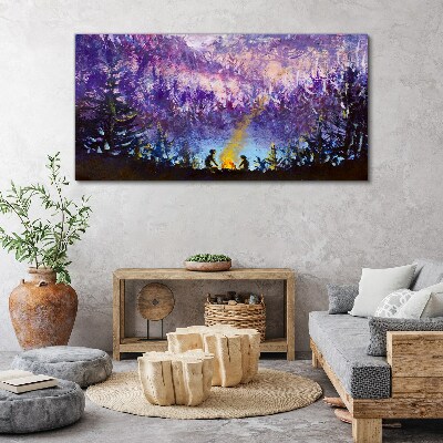 Tableau sur toile La magie d'un feu de camp en soirée dans la forêt