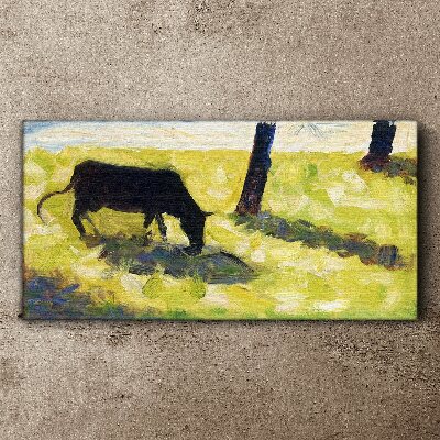 Tableau toile imprimée Une vache broutant dans un paysage verdoyant