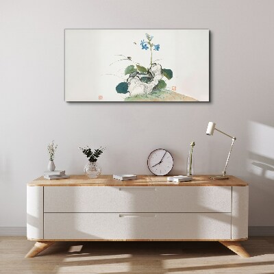 Tableau imprimé sur toile Une fleur sur un fond de pierre