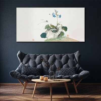 Tableau imprimé sur toile Une fleur sur un fond de pierre