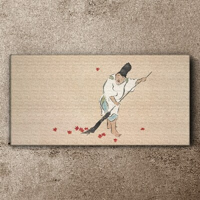 Tableau sur toile Moine nettoyant avec des feuilles
