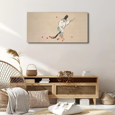 Tableau sur toile Moine nettoyant avec des feuilles