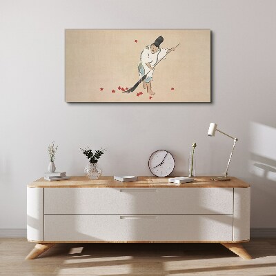 Tableau sur toile Moine nettoyant avec des feuilles