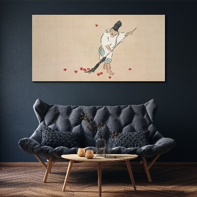 Tableau sur toile Moine nettoyant avec des feuilles