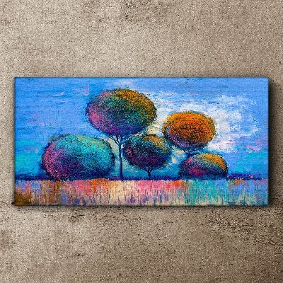 Tableau imprimé sur toile Arbres colorés sur fond bleu
