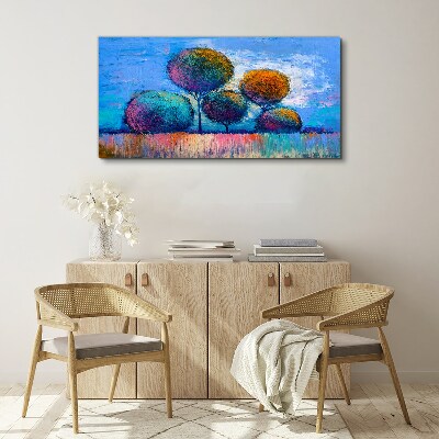Tableau imprimé sur toile Arbres colorés sur fond bleu
