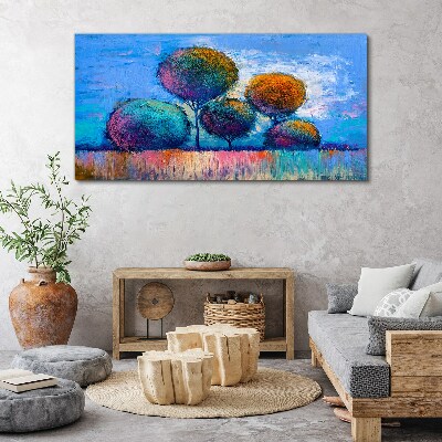 Tableau imprimé sur toile Arbres colorés sur fond bleu