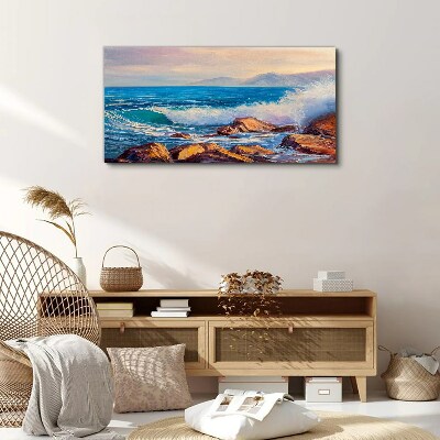 Tableau sur toile Vagues sur la côte au coucher du soleil