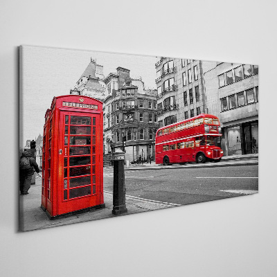 Tableau sur toile Un téléphone rouge dans une ville grise