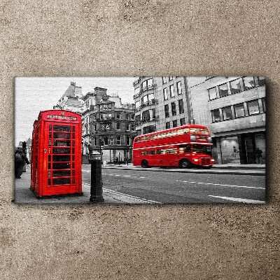 Tableau sur toile Un téléphone rouge dans une ville grise