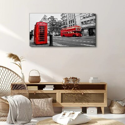 Tableau sur toile Un téléphone rouge dans une ville grise