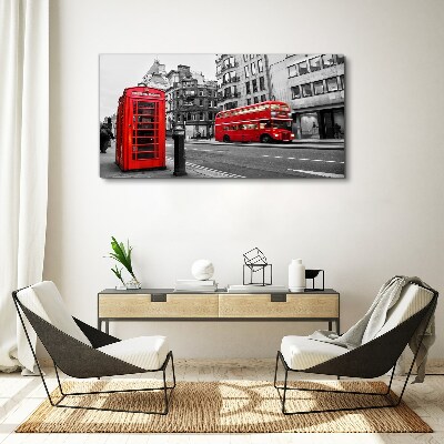 Tableau sur toile Un téléphone rouge dans une ville grise