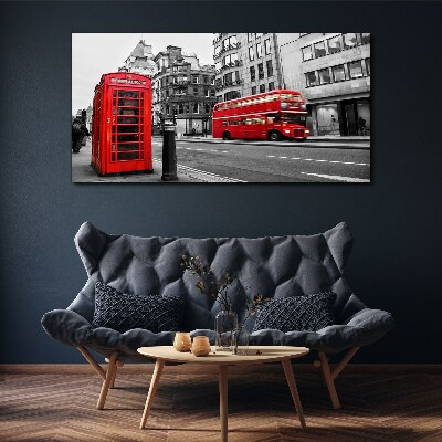 Tableau sur toile Un téléphone rouge dans une ville grise