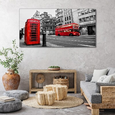 Tableau sur toile Un téléphone rouge dans une ville grise