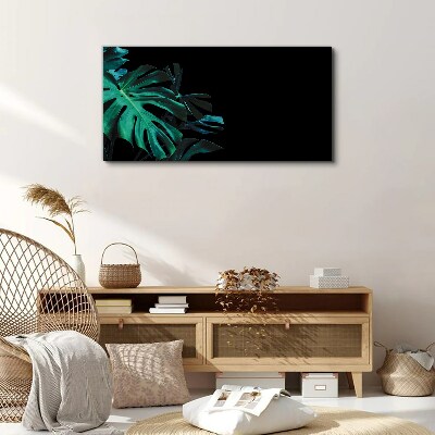 Tableau sur toile Feuilles vertes sur fond noir