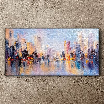 Tableau sur toile La ville dans la lueur du coucher du soleil
