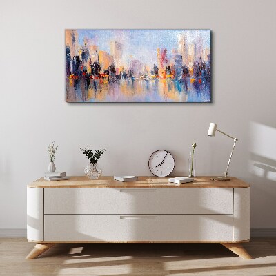 Tableau sur toile La ville dans la lueur du coucher du soleil