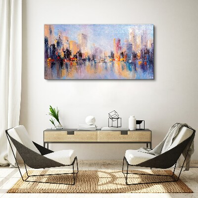 Tableau sur toile La ville dans la lueur du coucher du soleil