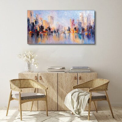 Tableau sur toile La ville dans la lueur du coucher du soleil