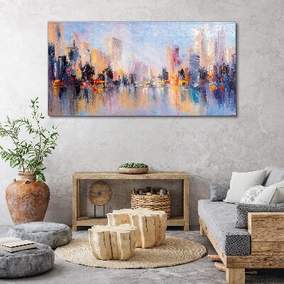 Tableau sur toile La ville dans la lueur du coucher du soleil