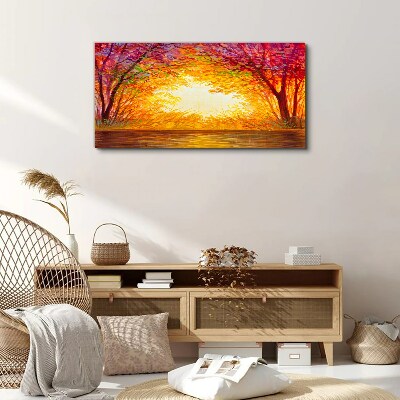 Tableau sur toile Coucher de soleil dans une forêt colorée