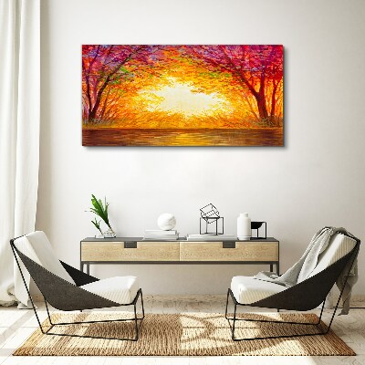 Tableau sur toile Coucher de soleil dans une forêt colorée