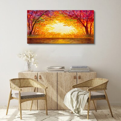 Tableau sur toile Coucher de soleil dans une forêt colorée