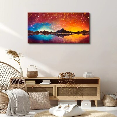 Tableau sur toile Coucher de soleil sur un lac de montagne