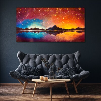 Tableau sur toile Coucher de soleil sur un lac de montagne