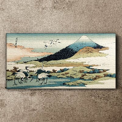 Tableau toile imprimée Grues près d'une montagne