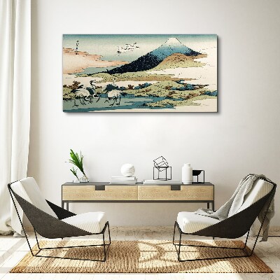 Tableau toile imprimée Grues près d'une montagne