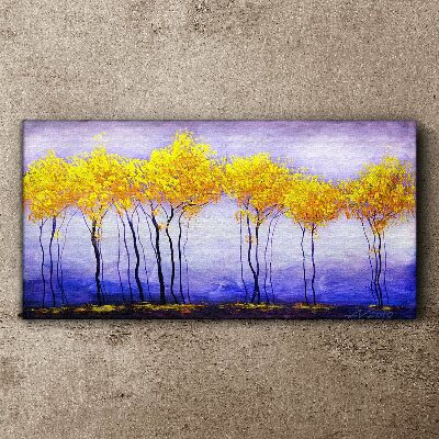 Tableau sur toile Des arbres dorés dans un paysage violet