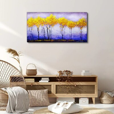 Tableau sur toile Des arbres dorés dans un paysage violet