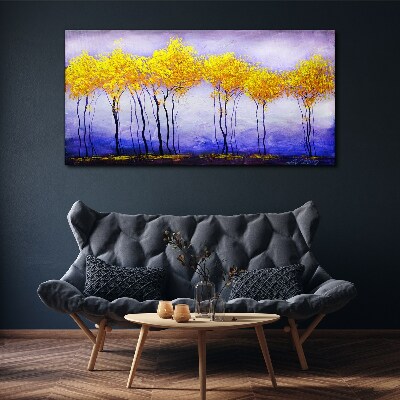Tableau sur toile Des arbres dorés dans un paysage violet