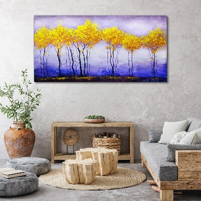 Tableau sur toile Des arbres dorés dans un paysage violet