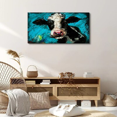 Tableau toile imprimée Portrait d'une vache sur fond bleu