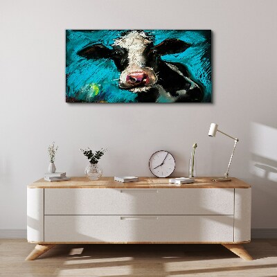 Tableau toile imprimée Portrait d'une vache sur fond bleu