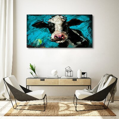 Tableau toile imprimée Portrait d'une vache sur fond bleu