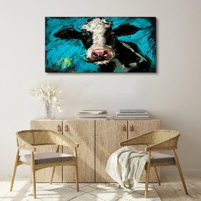 Tableau toile imprimée Portrait d'une vache sur fond bleu