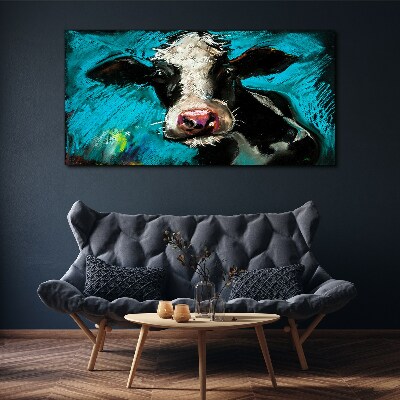 Tableau toile imprimée Portrait d'une vache sur fond bleu