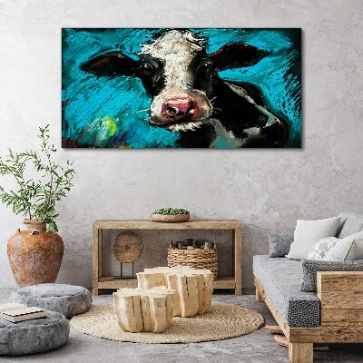 Tableau toile imprimée Portrait d'une vache sur fond bleu