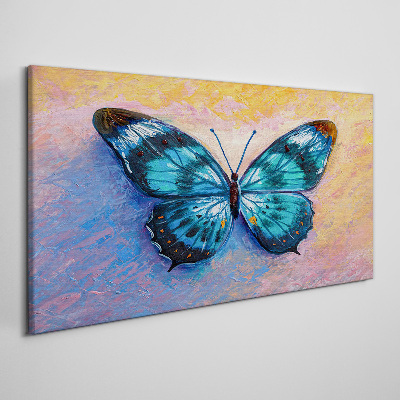 Tableau sur toile Papillon bleu sur fond pastel