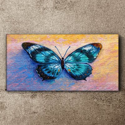 Tableau sur toile Papillon bleu sur fond pastel