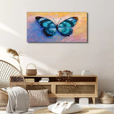 Tableau sur toile Papillon bleu sur fond pastel
