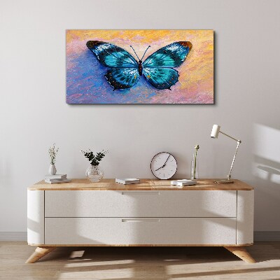 Tableau sur toile Papillon bleu sur fond pastel