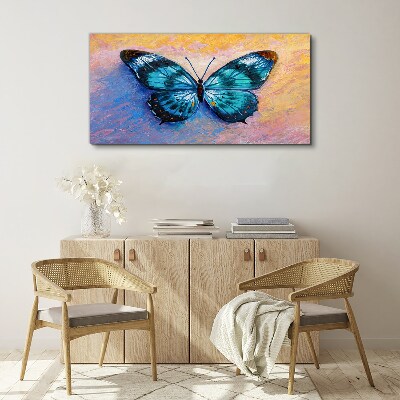 Tableau sur toile Papillon bleu sur fond pastel