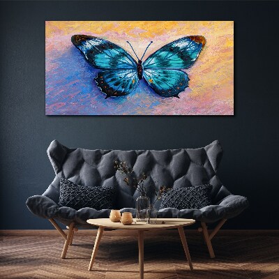 Tableau sur toile Papillon bleu sur fond pastel