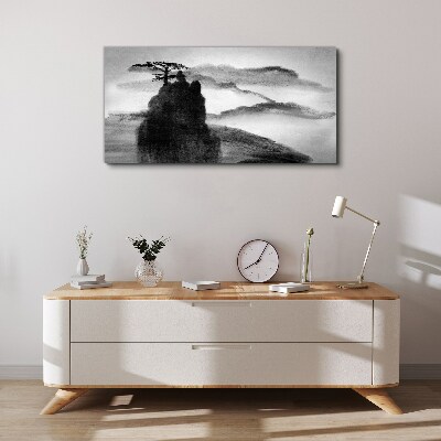 Tableau sur toile Un arbre solitaire sur une montagne rocheuse