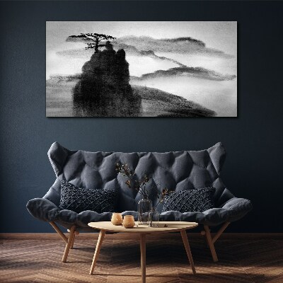 Tableau sur toile Un arbre solitaire sur une montagne rocheuse