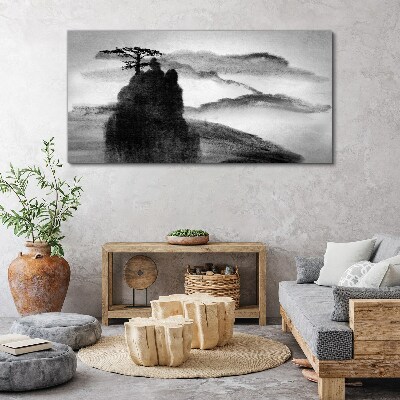 Tableau sur toile Un arbre solitaire sur une montagne rocheuse